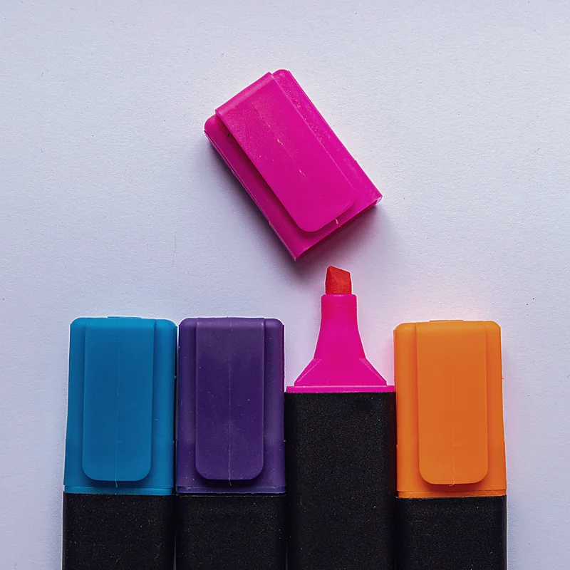 Four bright highlighters laid out like a brand color palette